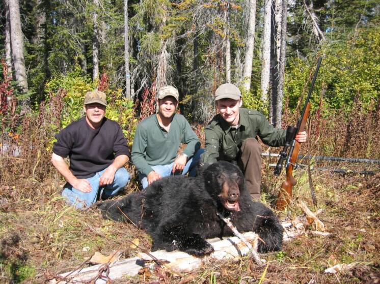 Successful black bear hunt!  Dave (outfitter), Travis (guide) and client